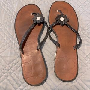 Coach leather black and white daisy flip flop sandals